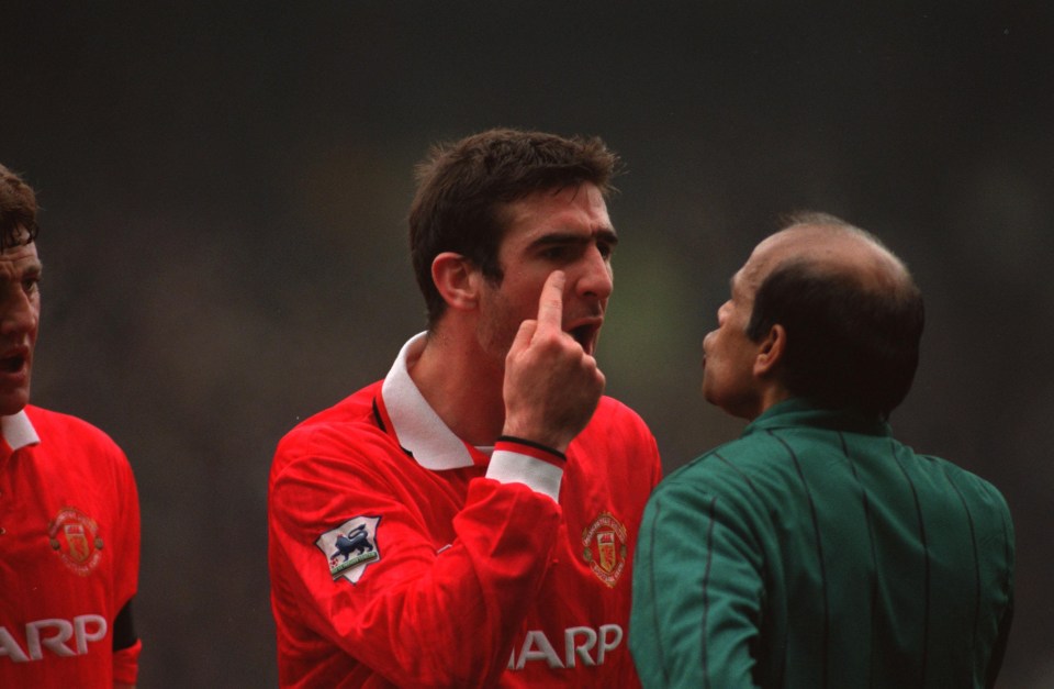 Eric Cantona argues with the referee while playing for Manchester United