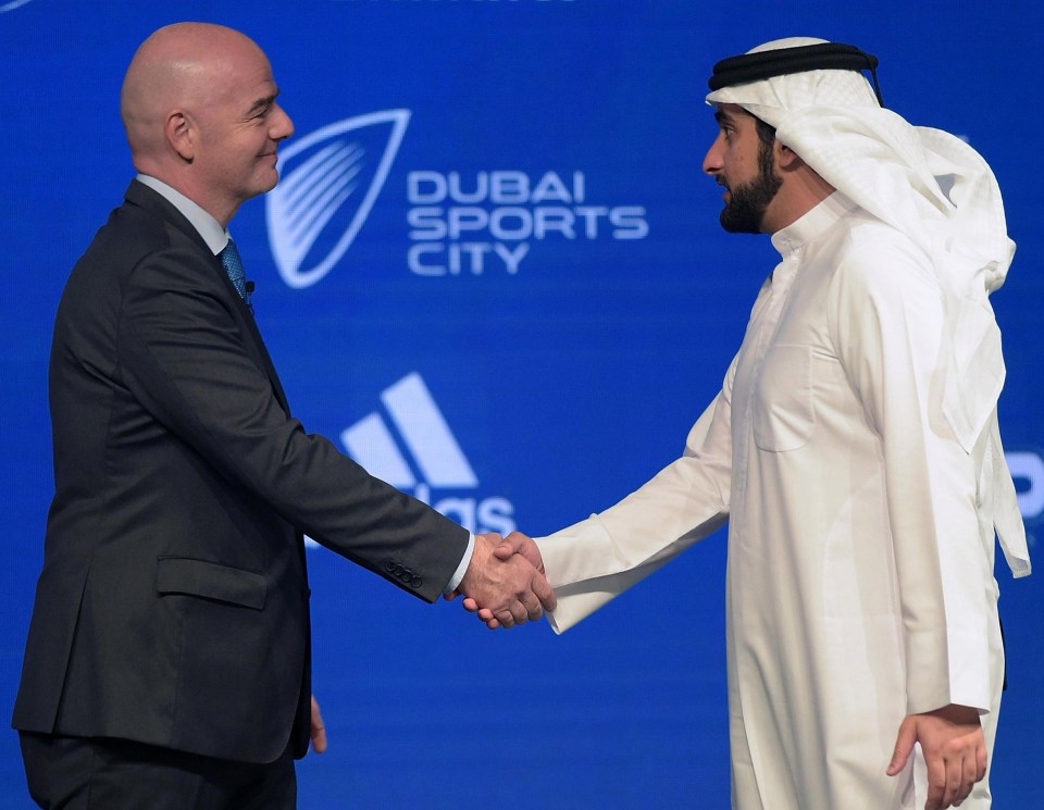 FIFA President Gianni Infantino greets the Dubai ruler, Sheikh Maktoum Bin Mohammed Bin Rashid Al Maktoum, who forced the three-club merger