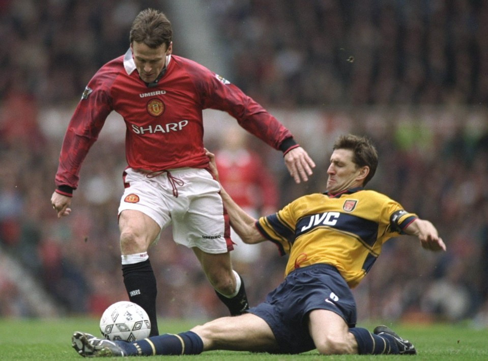 Adam makes a slide tackle on United forward Teddy Sheringham