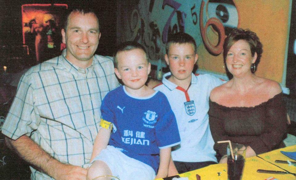 Rhys Jones pictured with his dad Steve, mum Mel and brother Owen before he was tragically killed