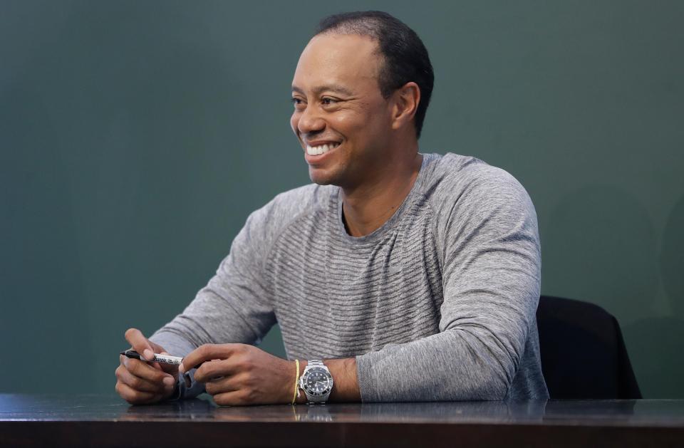  Tiger Woods was pictured signing copies of his book The 1997 Masters: My Story in New York on March 20