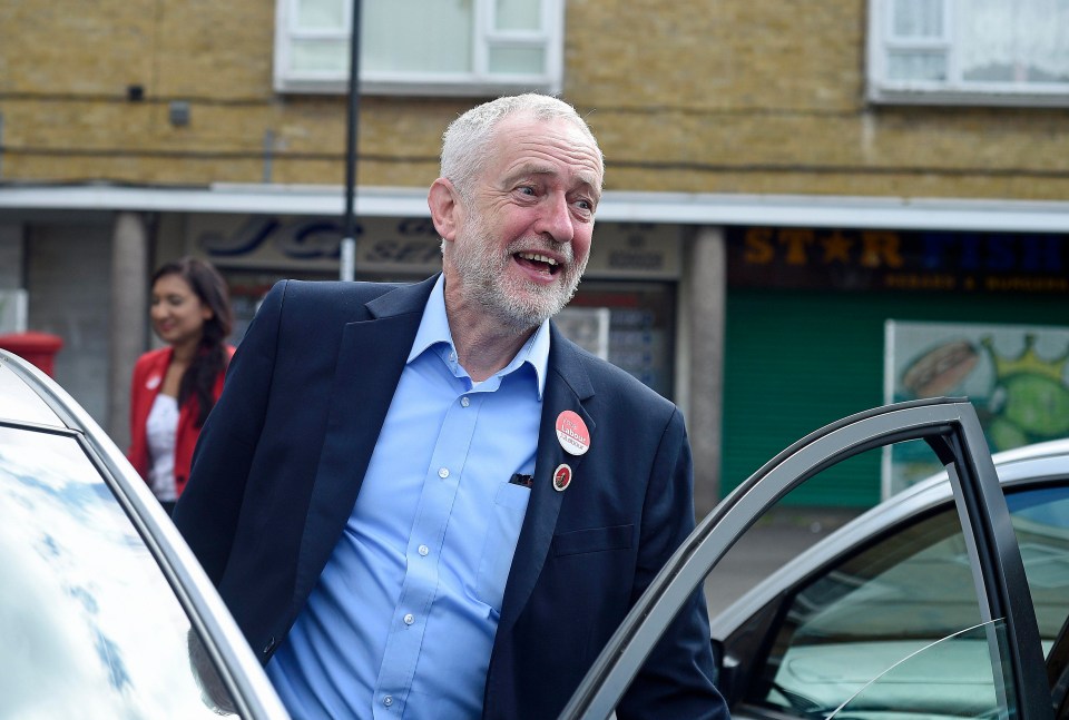 Theresa May has attacked Jeremy Corbyn with a poster and dossier