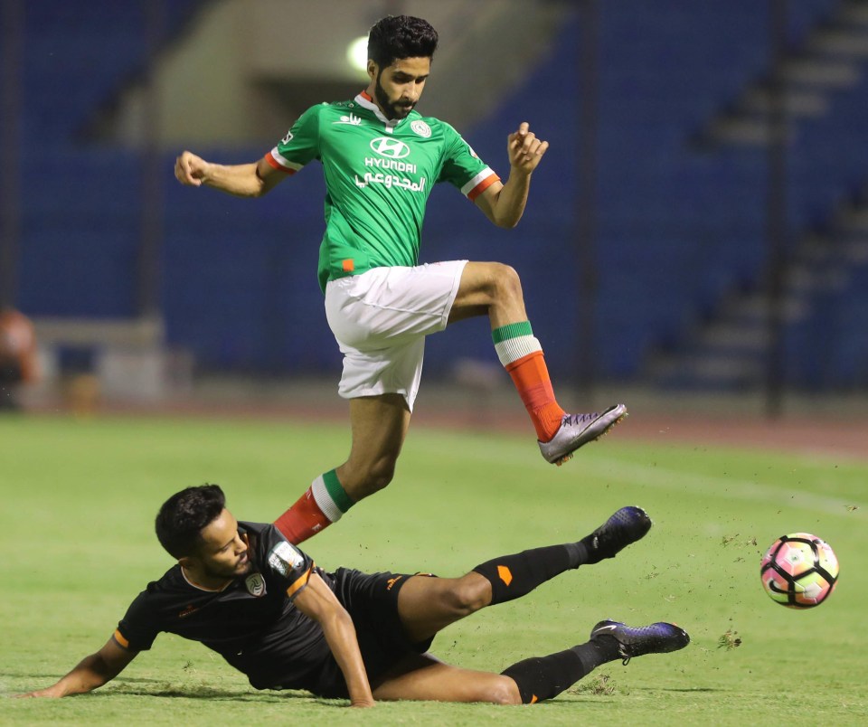 Al-Shabab player Sultan Al-Doayea tangles with Al-Ettifaq ace Hazza Al-Hazza 