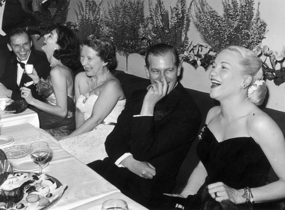  Duke of Edinburgh shares an after dinner joke with opera singer Dorothy Kirsten with Frank Sinatra and Eva Gardener at the table