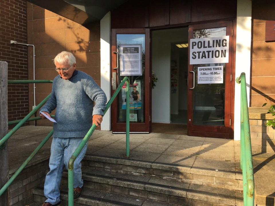 A pensioner leaves the polling station after voting during the local election of councillors to Dorset County Council