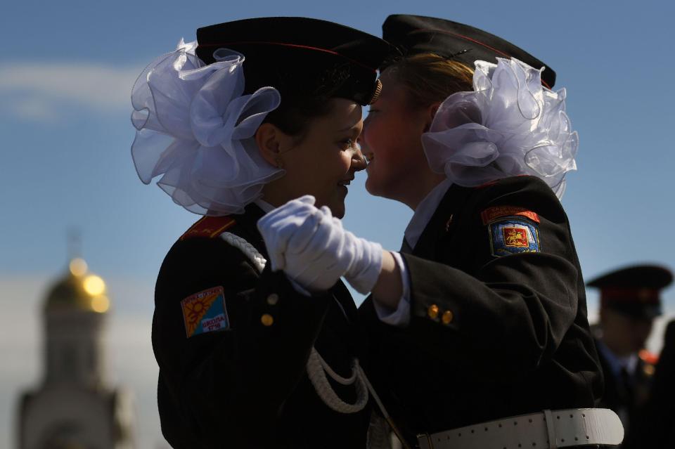  Russian female cadets dance ahead of a parade in Moscow's Poklonnaya Gora War Memorial Park