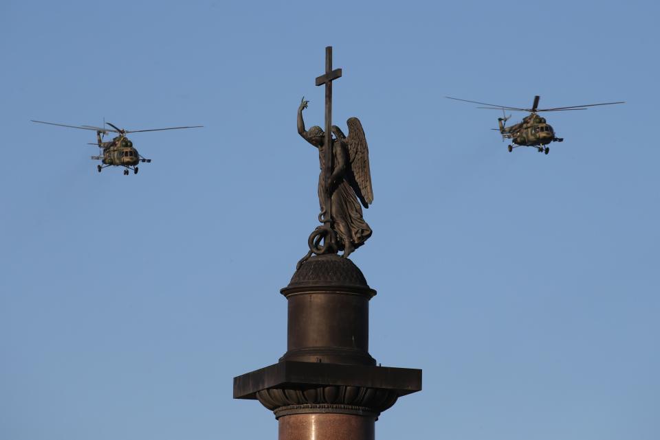  Mil Mi-8 multipurpose helicopters take to the skies over St Petersburg's Palace Square