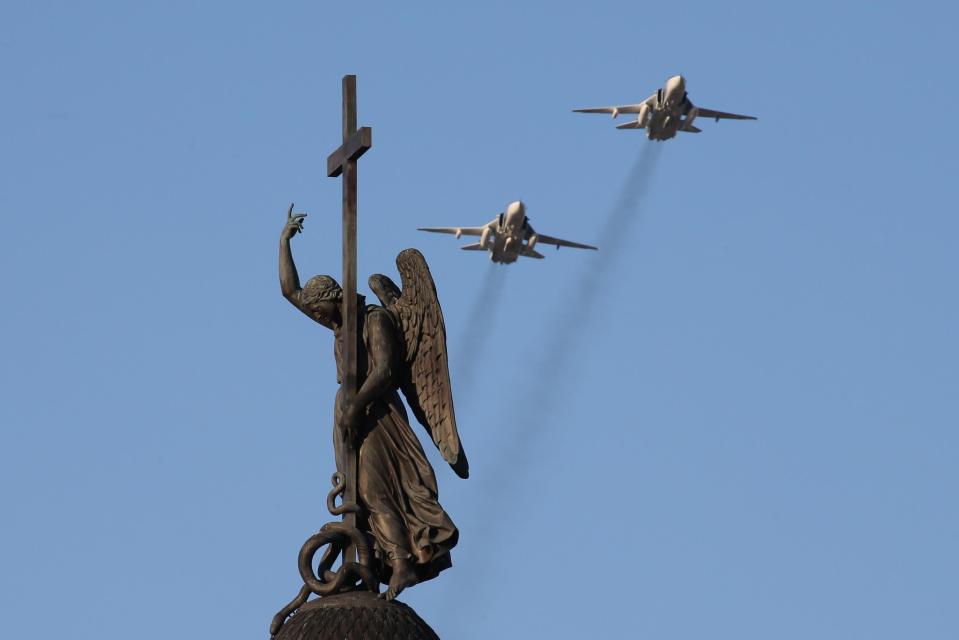  Sukhoi Su-24M bombers- recently in action in Syria - fly over St Petersburg's Palace Square