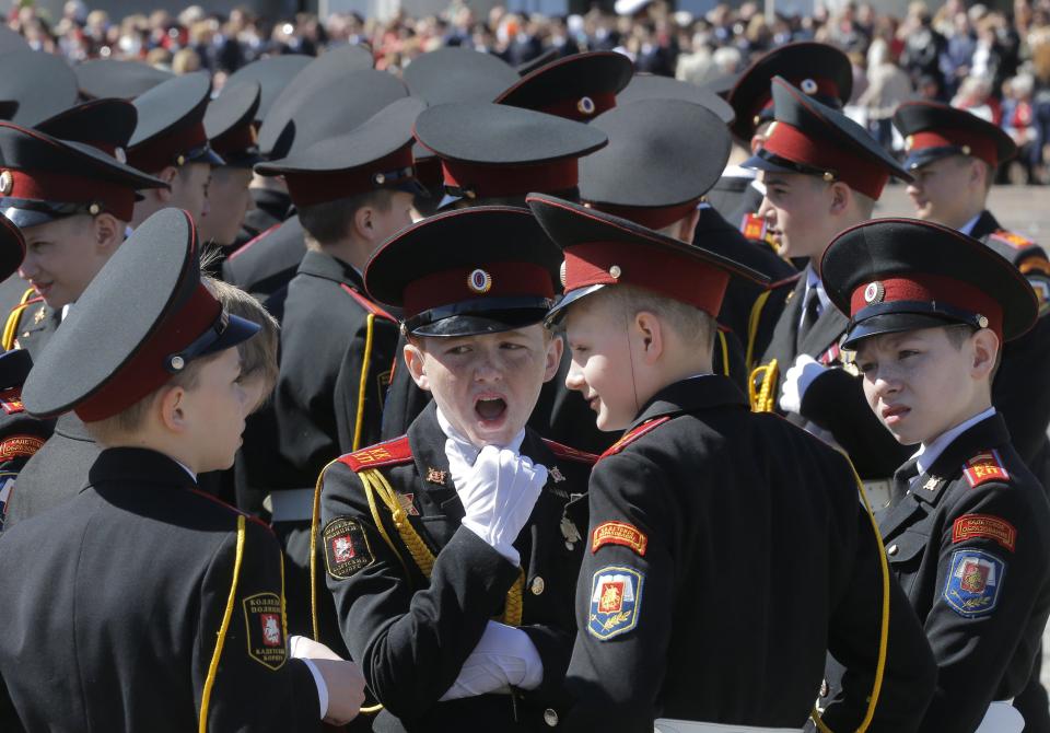  A Russian cadet yawns at the start of a cadets parade in the Victory Park Memorial, Moscow