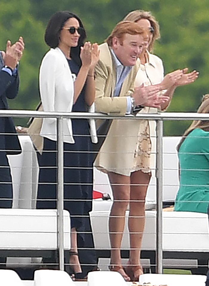  Meghan claps the players during the outing in Berkshire