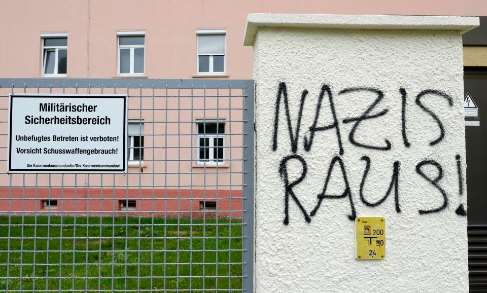  Graffiti reads 'Nazis out!' near the main gate of the Fuerstenberg barracks in Donaueschingen, Germany