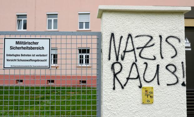 Graffiti reads 'Nazis out!' near the main gate of the Fuerstenberg barracks in Donaueschingen, Germany