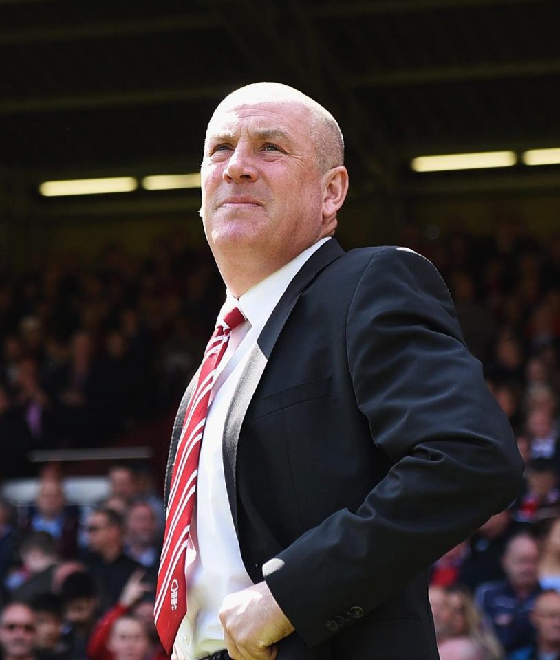  Forest boss Mark Warburton looks on as his side survive on the final day