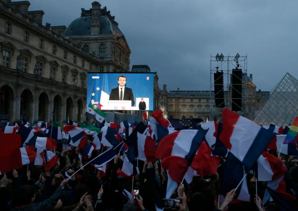 Supporters in Paris cheered as Macron told the world: 'France has won' 