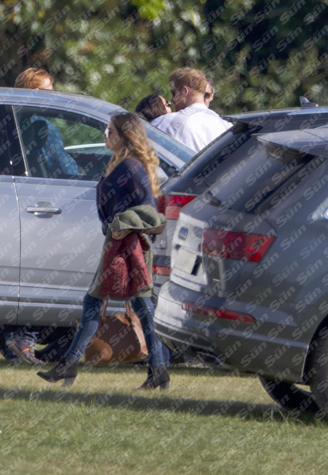  The couple locked lips ahead of the polo match