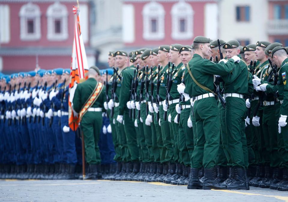  Thousands of soldiers took part as Putin watched on from above