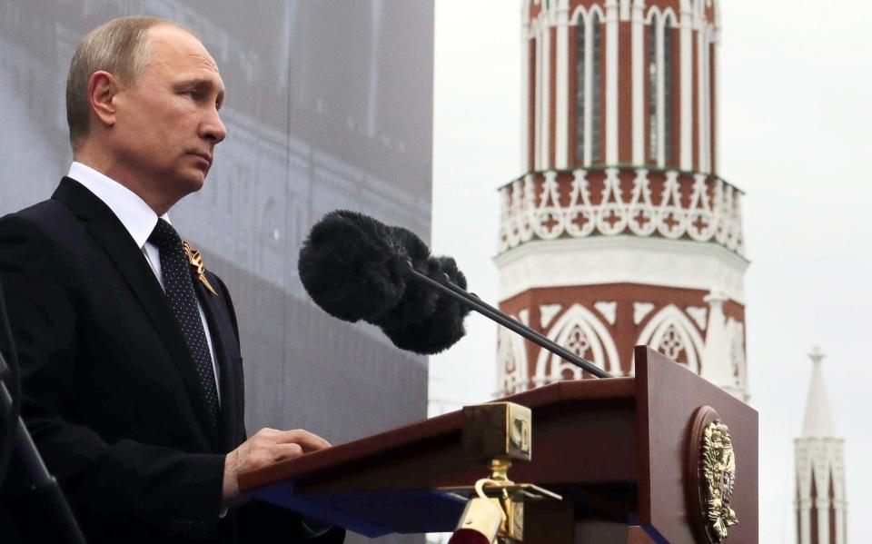  President Vladimir Putin addresses the crowd during the annual parade