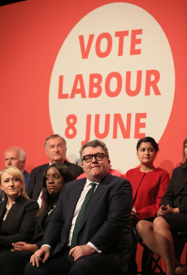  Labour's deputy leader Tom Watson watches on as Mr Corbyn takes on Brexit in his speech