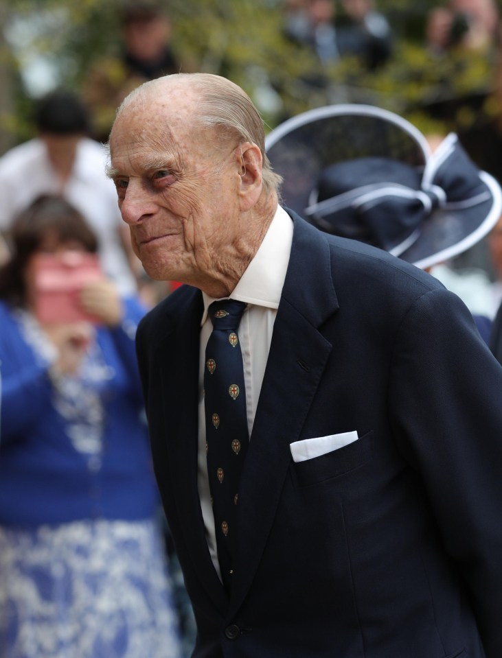 Prince Philip is pictured for the first time since the day he announced his retirement – as he joined the Queen on a visit to a naval school