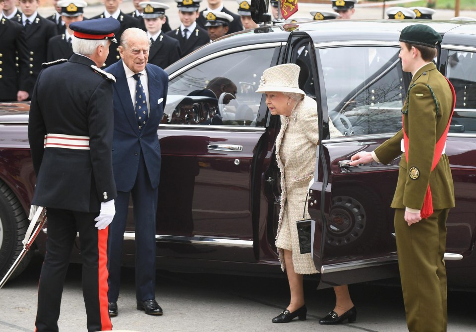 As protocol dictates The Prince patiently waited for The Queen to exit the Royal car