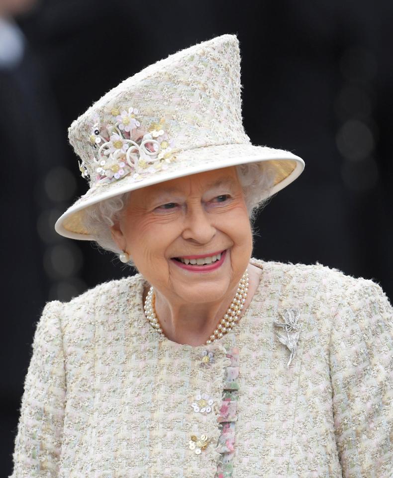  Her Majesty wore a pastel tweed dress and coat in shades of pale pink for the occasion