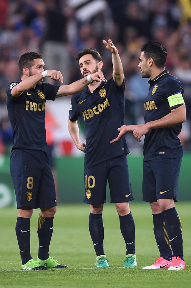  Monaco's Joao Moutinho (2ndL) speaks with team-mates Bernardo Silva and Radamel Falcao during the defeat