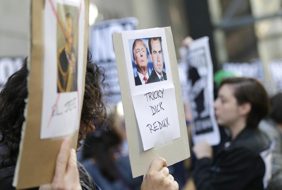  Protesters are comparing Comey’s discharge to when Nixon sacked special prosecutor Archibald Cox during the Watergate scandal