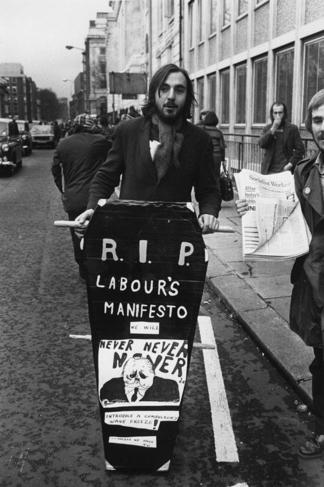  An unemployed person makes his protest by wheeling a coffin through the streets on London 1975