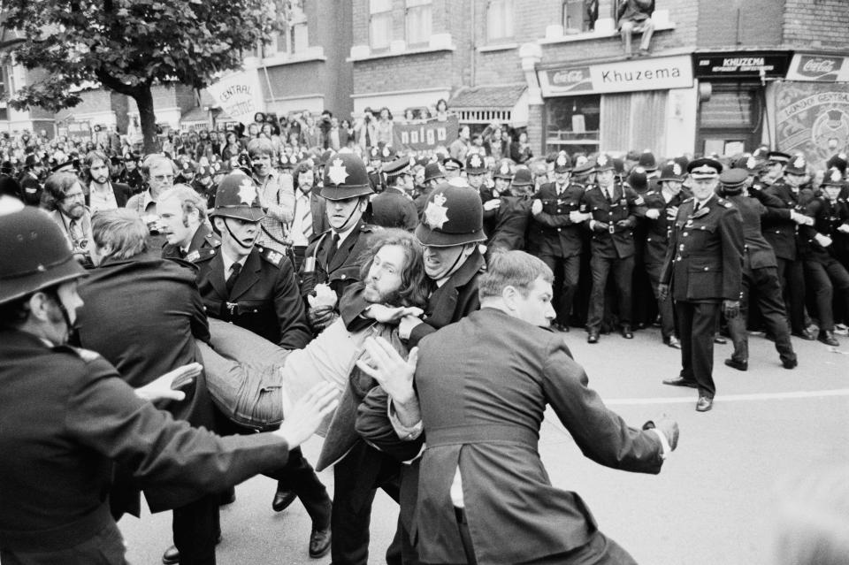  Police and demonstrators clash in a residential street following picketing action by union members of the Grunwick film processing factory in Willesden during a labour dispute in 1977