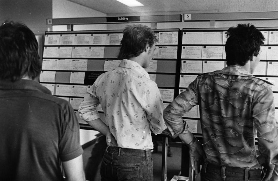  Young men scour notice boards at the Jobs Centre. In 1974, employment was in excess of one million - it had been less than 600,000 at the start of the decade