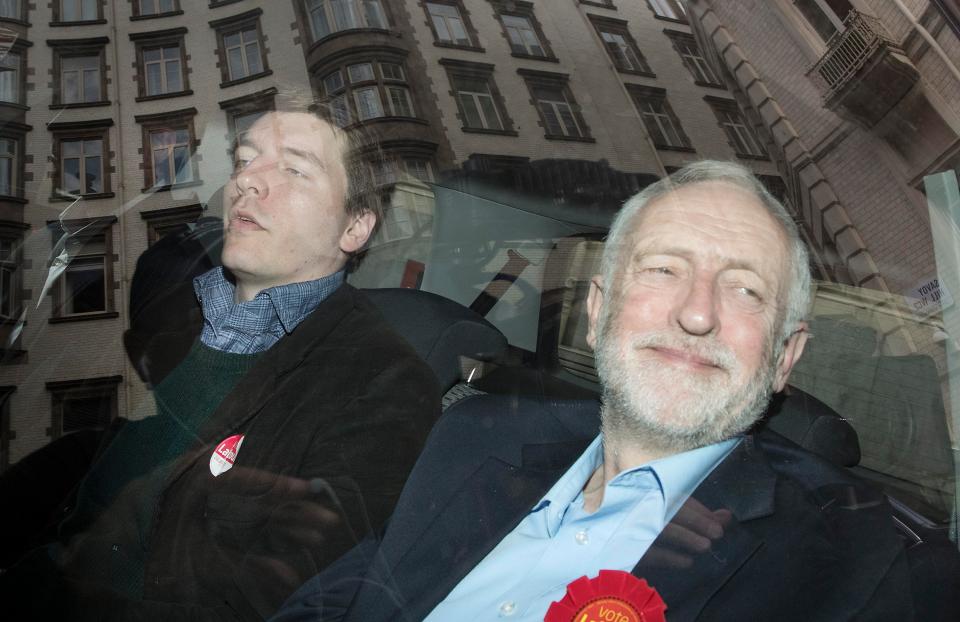  Corbyn is still smiling as he arrives at meeting with aide James Schneider following leaked manifesto