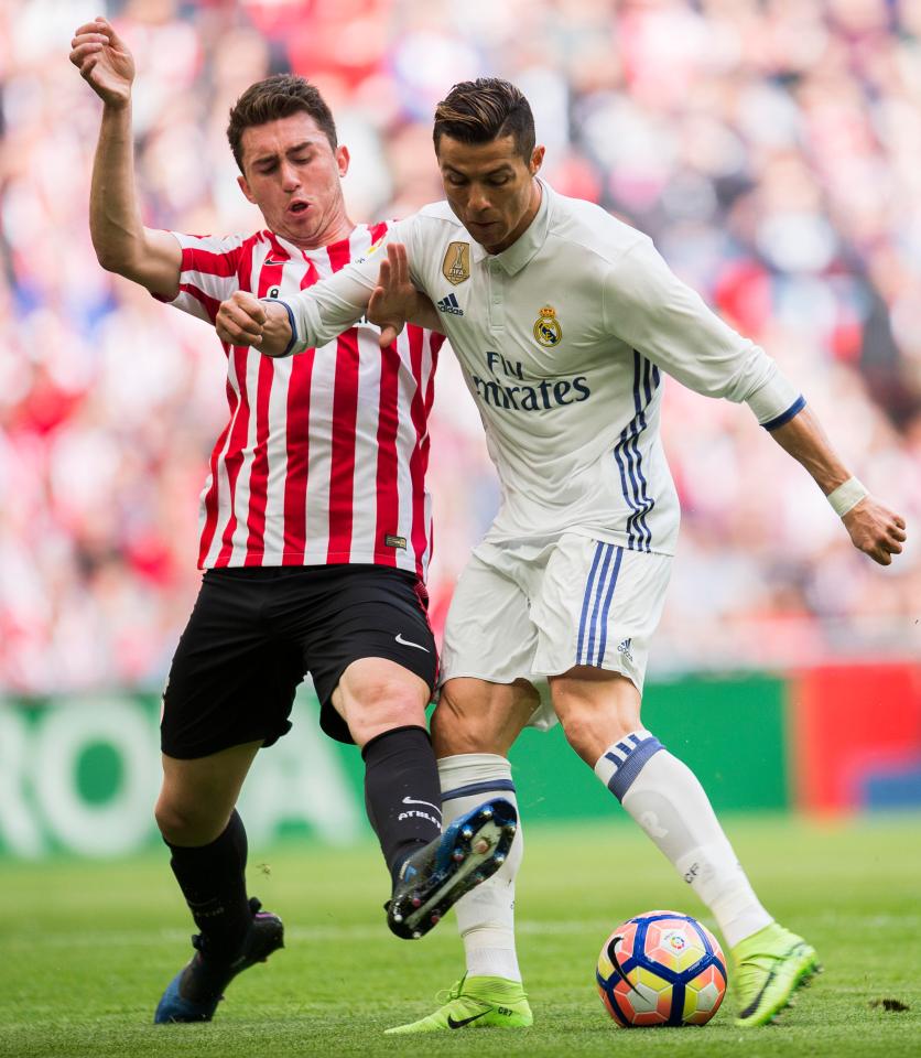 Aymeric Laporte (left) shown tackling Cristiano Ronaldo, is one of Pep Guardiola's top defensive summer targets