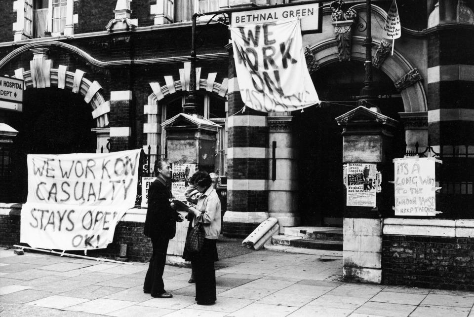  A passer-by signs a petition to keep open the casualties department at Bethnal Green hospital, which was due to be closed down because of budget cuts in 1978