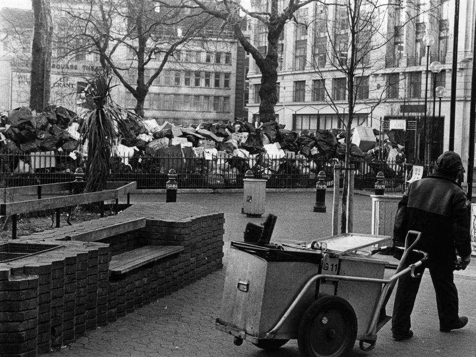  A refuse collector who is employed by Westminster City Council empties bins around Leicester Square in 1979