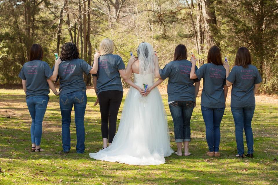  Jen with her almost bridesmaids, pictured in March, wearing ‘Team Ex-bride’ T-shirts that she had printed for the party