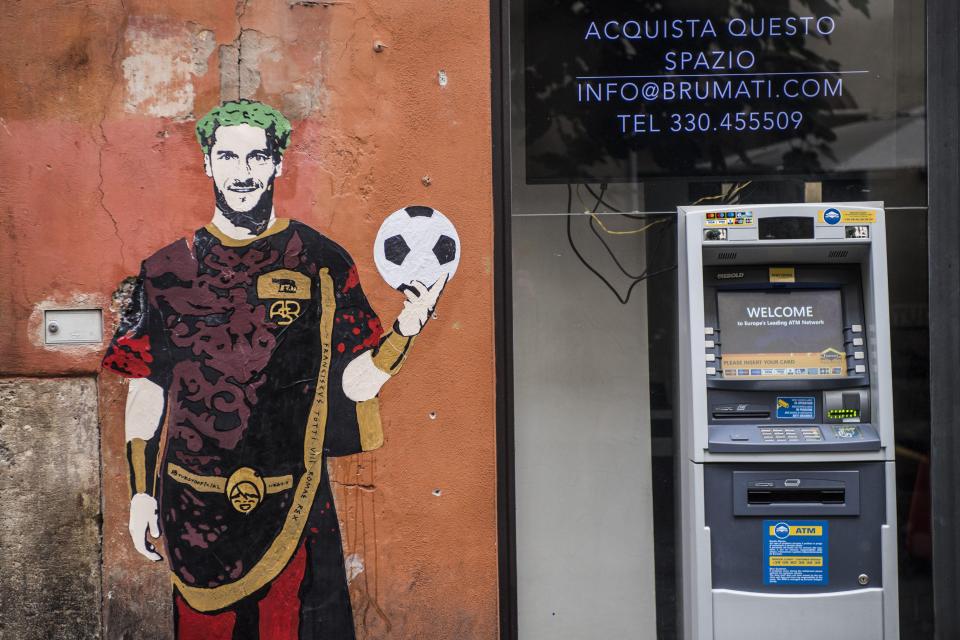  The Roma supporters idolise Totti and have even taken to painting murals of him across Rome