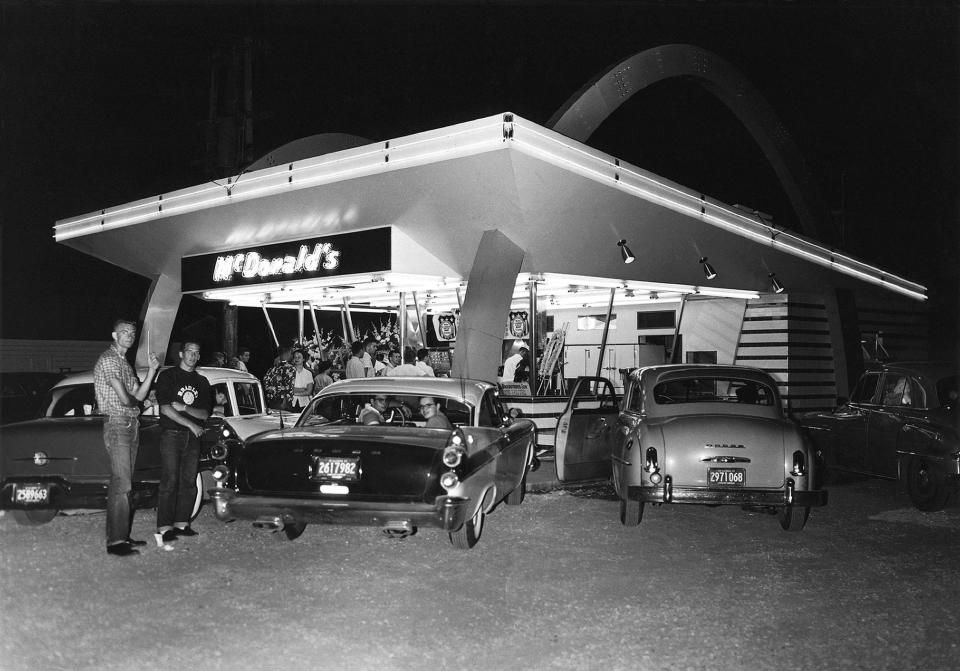  Customers park outside one of the first McDonald's outlets in Des Plaines Illinois in 1955