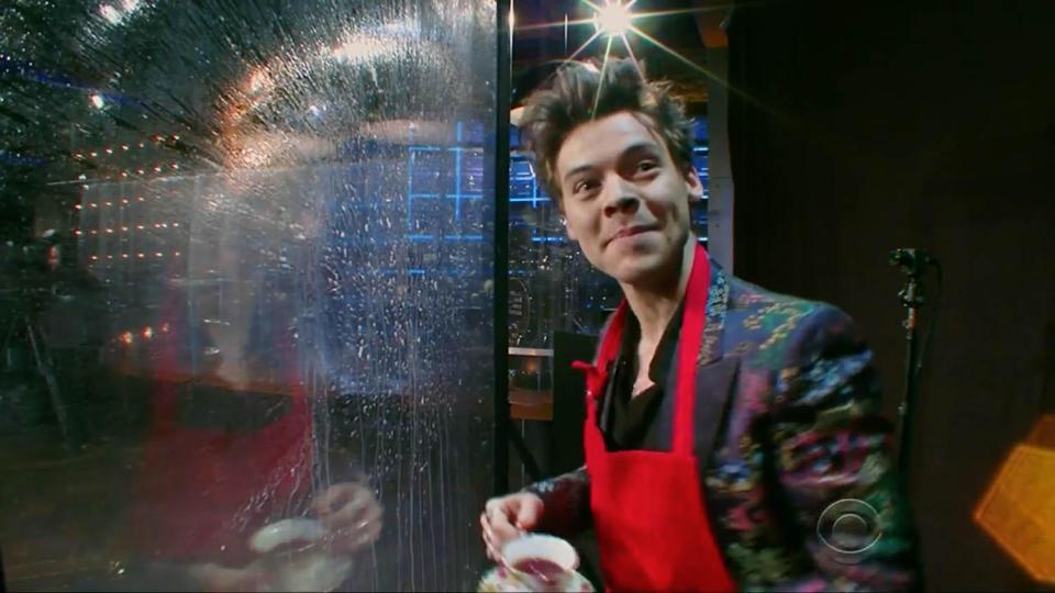  Harry also took part in a game of Flinch which involved him standing behind a glass screen while James threw fruit at him