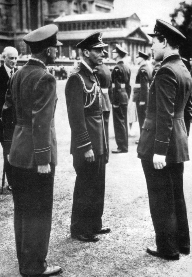  Colin, (right), meets King George VI at Buckingham palace when he 604 squadron won a prize