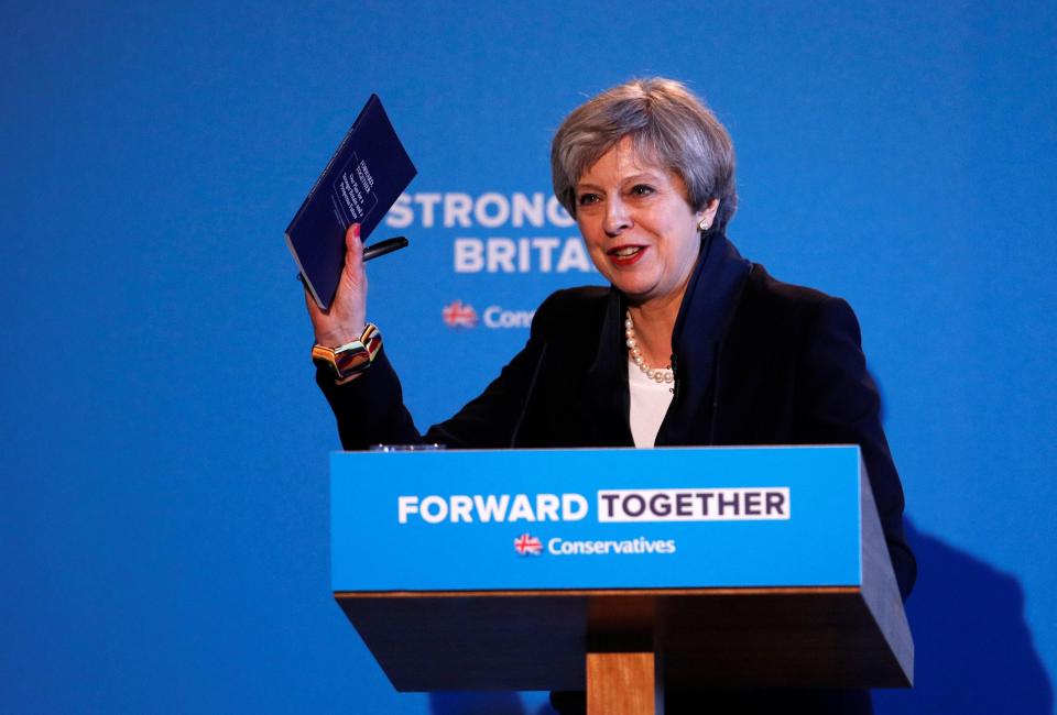 Theresa May pictured unveiling the Conservative manifesto in Halifax this morning