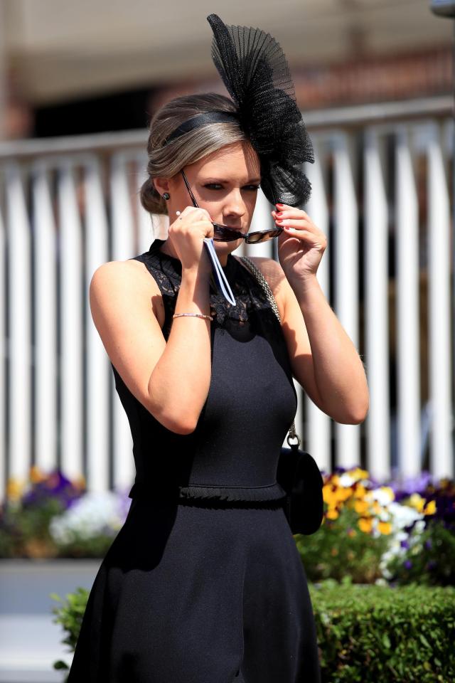  One lady puts on her sunglasses as the sun came out at the festival