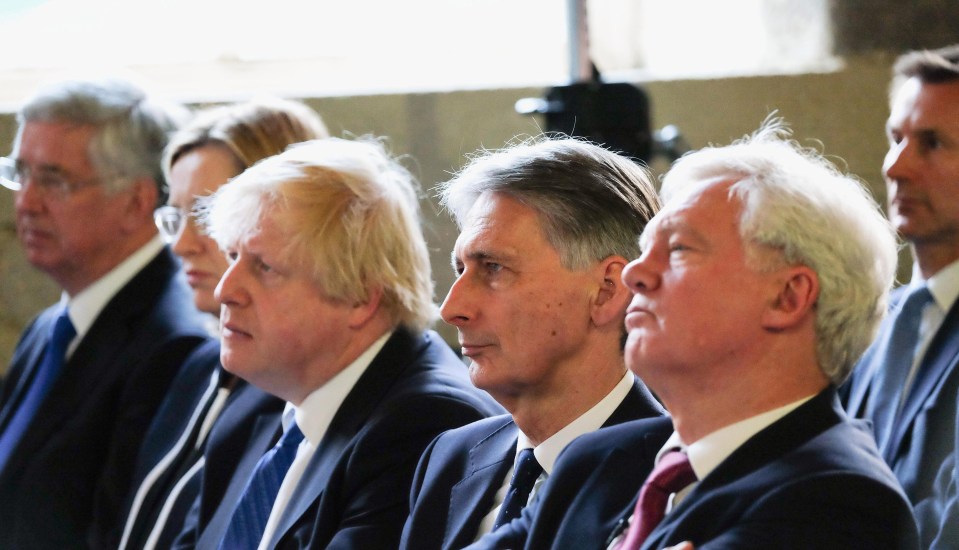 Foreign Secretary Boris Johnson, Chancellor Philip Hammond and Brexit Secretary David Davis listen as the PM speaks