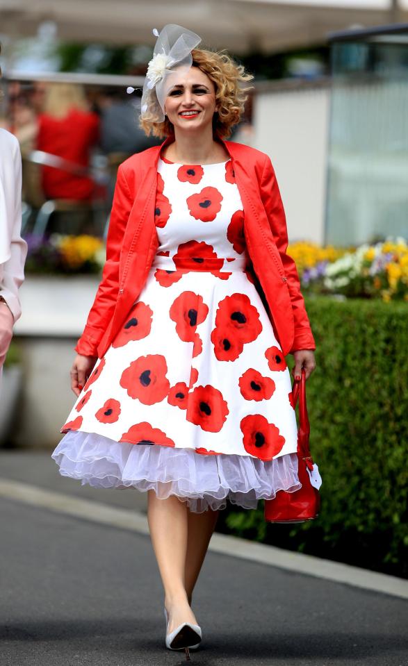  One female racegoer opted for a white dress which was decorated with red poppies