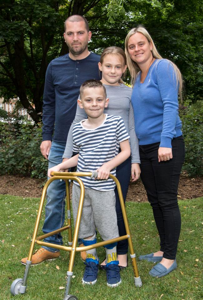  Harry with Danielle, Glen, and older sister Mia, 10, in their garden in Waltham Abbey