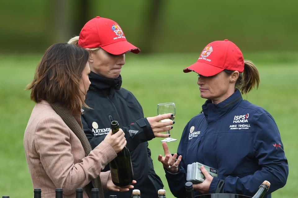  Zara Tindall (centre) hands Dolly Maude (right) a wee drink