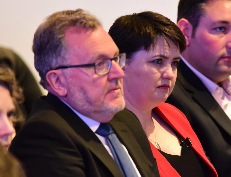 David Mundell, pictured with Ms Davidson at the manifesto launch, also defended the decision