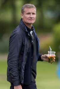  David Coulthard quenches his thirst as the golf fundraiser gets underway