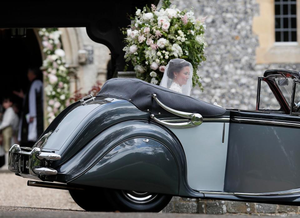  Pippa arrived in an open-topped old-fashioned motor with her father Michael