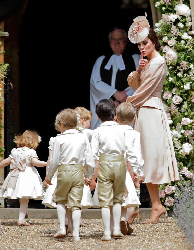  Kate hushed the excitable children as they all bound into the church for the ceremony