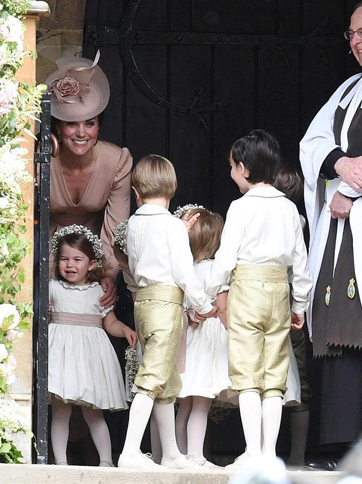  Kate grins as she prepares the page boys and flower girls for their roles